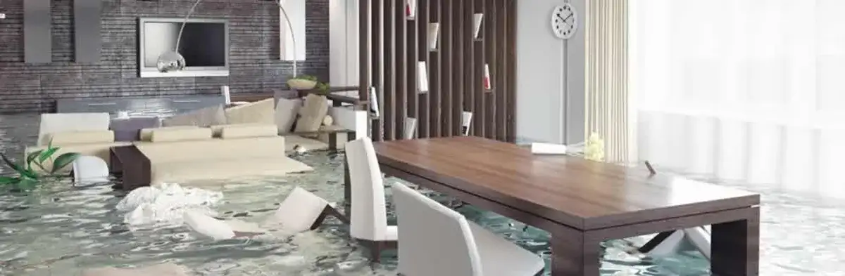 home interior affected by water damage with flooded floors and displaced furniture in Wilmington, NC